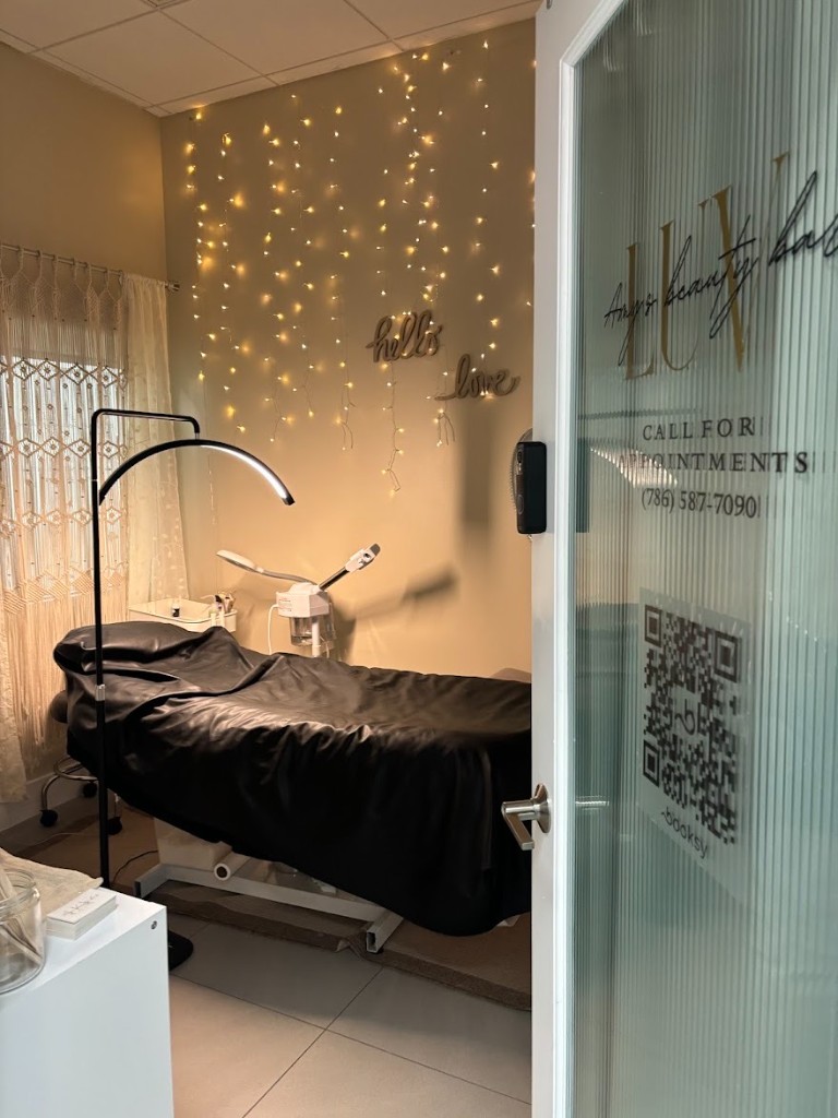 Inside Amy's Beauty Bar studio — treatment room with warm lighting
